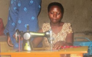 woman sewing in Uganda