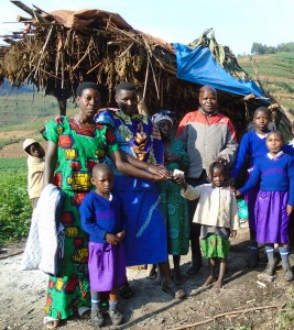 Gloria with her carers and pupils at GNMS at the hut she calls home