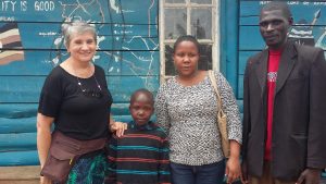 Alex arrives at Amazing Love School, with Peace, Monica and Headteacher Justus